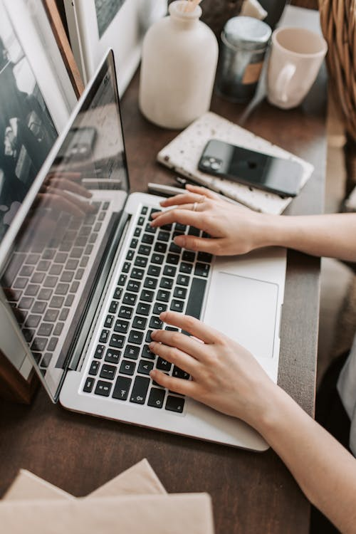 A female freelancer using a laptop at home