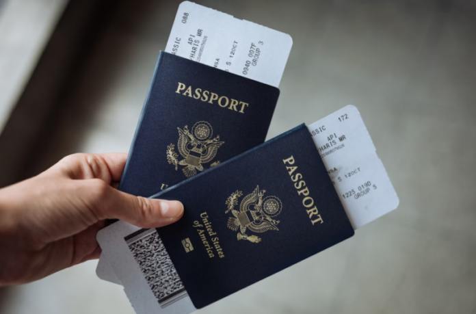 A person holding two passports